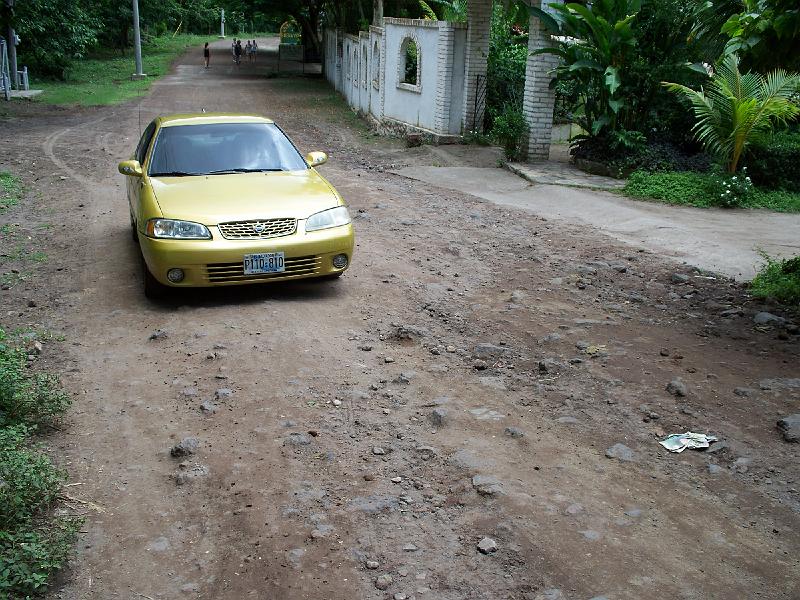 100_2434.jpg - The roads on the island -- of the main one -- are really bad.  In hindsight, this car was not appropriate for going on roads off the main road.   However, that's where all the interesting hotels are and such.  I'm not sure what we'd do if we wanted to go again... Risk damaging the car?   Rent one?  Not sure...