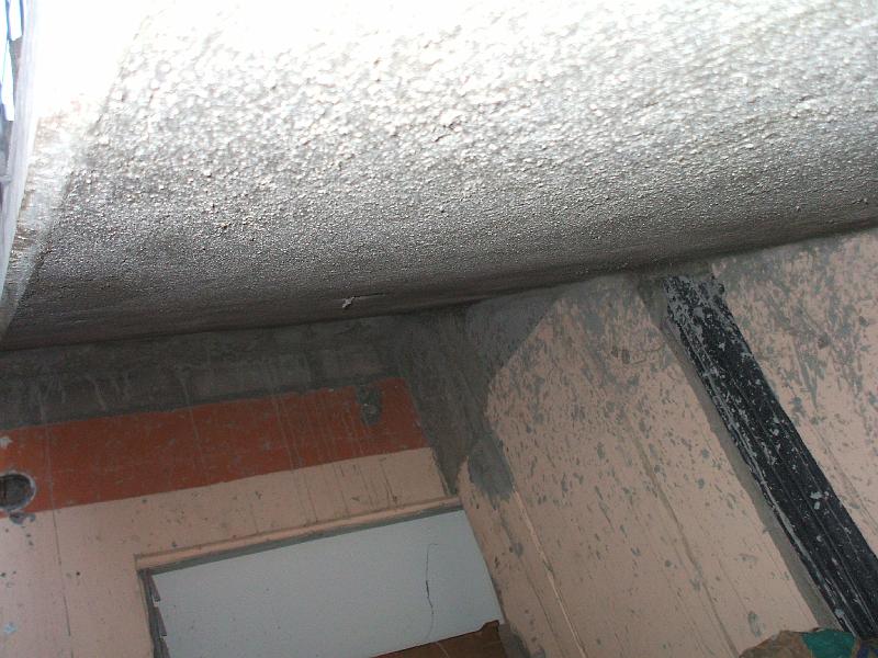 DSCF2088.JPG - We took several pictures under the stairs because it was hard to describe to people who were cruious.  The black conduits on the wall in the right of the picture is for electrical wiring.  The electrical panel is just below the lower right portion of the photo.