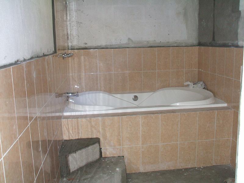 DSCF2165.JPG - Upstairs bathroom in progress.  We later decided to add tile up higher above the bathtub.