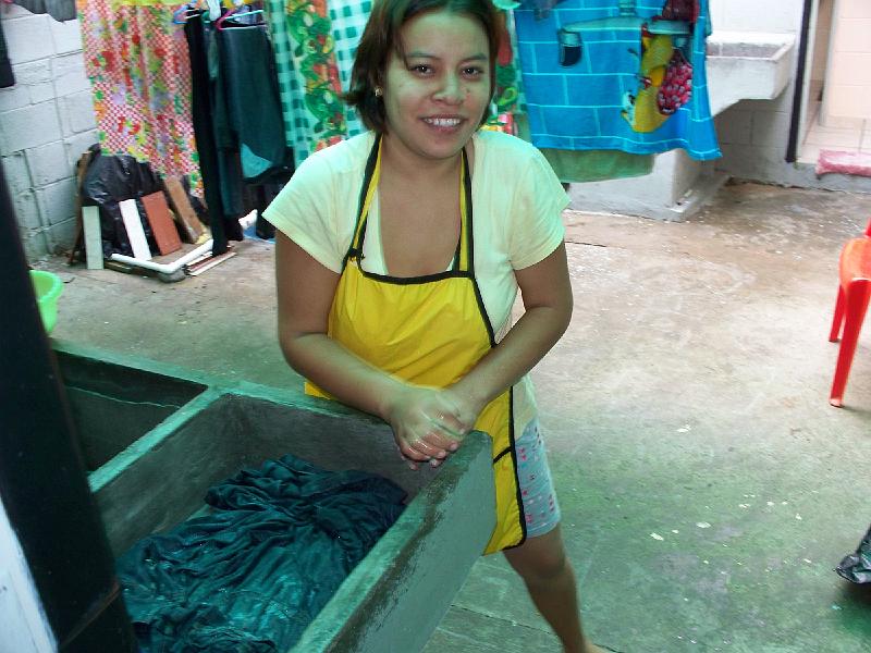 100_1287.jpg - Sandra working hard; doing the laundry.