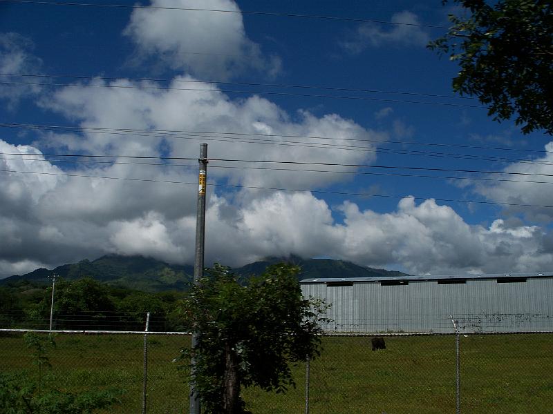 100_1312.jpg - Taking pictures from a bus window is always a challenge but I really was after the mountain in the backgorund here.  The utility pole and shed?  Not so much.